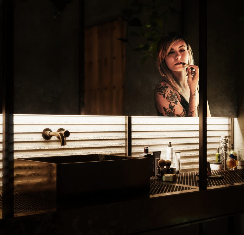punk girl painting her lips in front of a mirror with light contrast