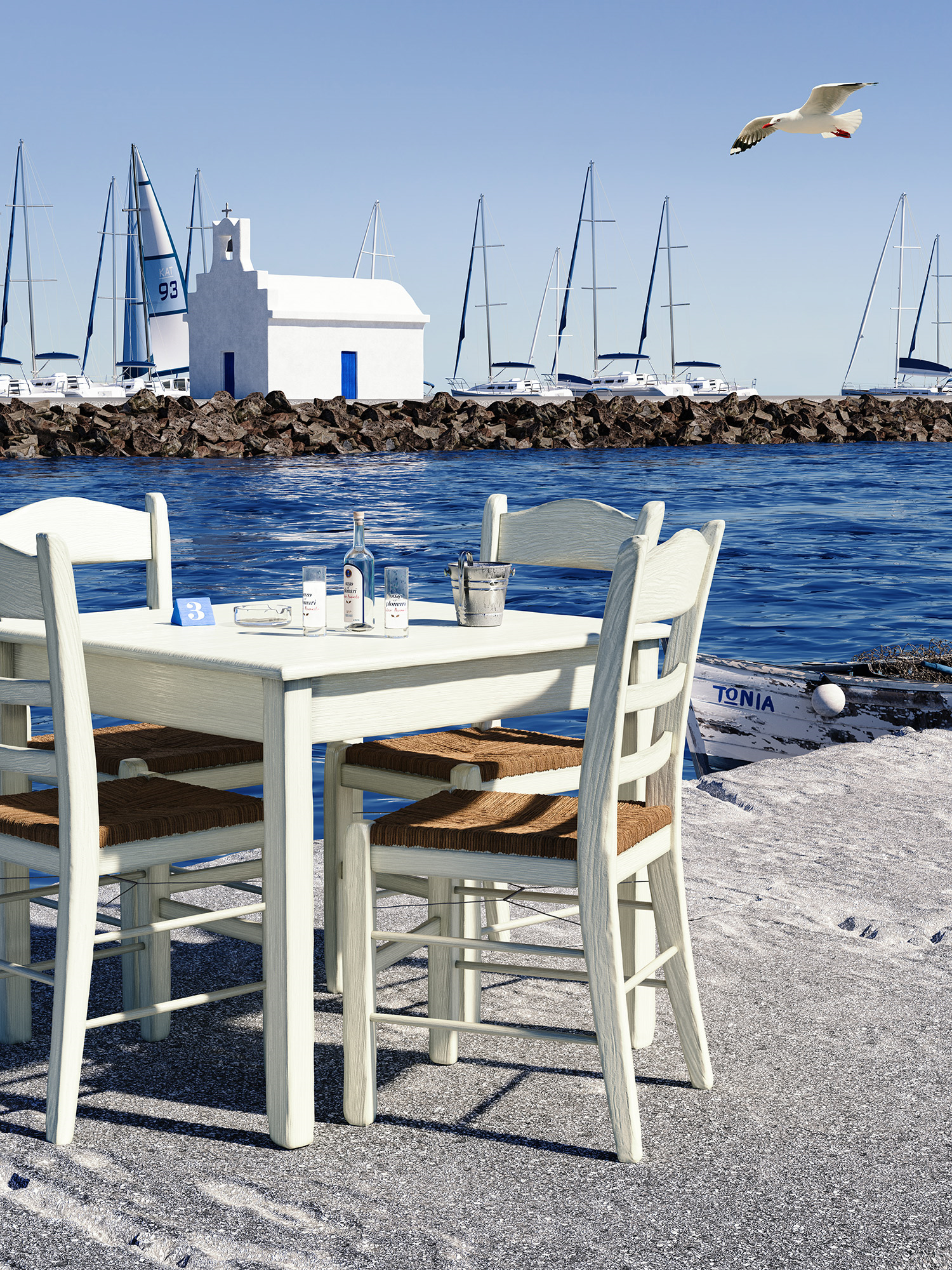 Stin Ygeia Mas table and chairs next to the sea in greek island